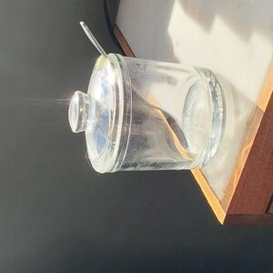 Small sauce or pepper glass container with spoon